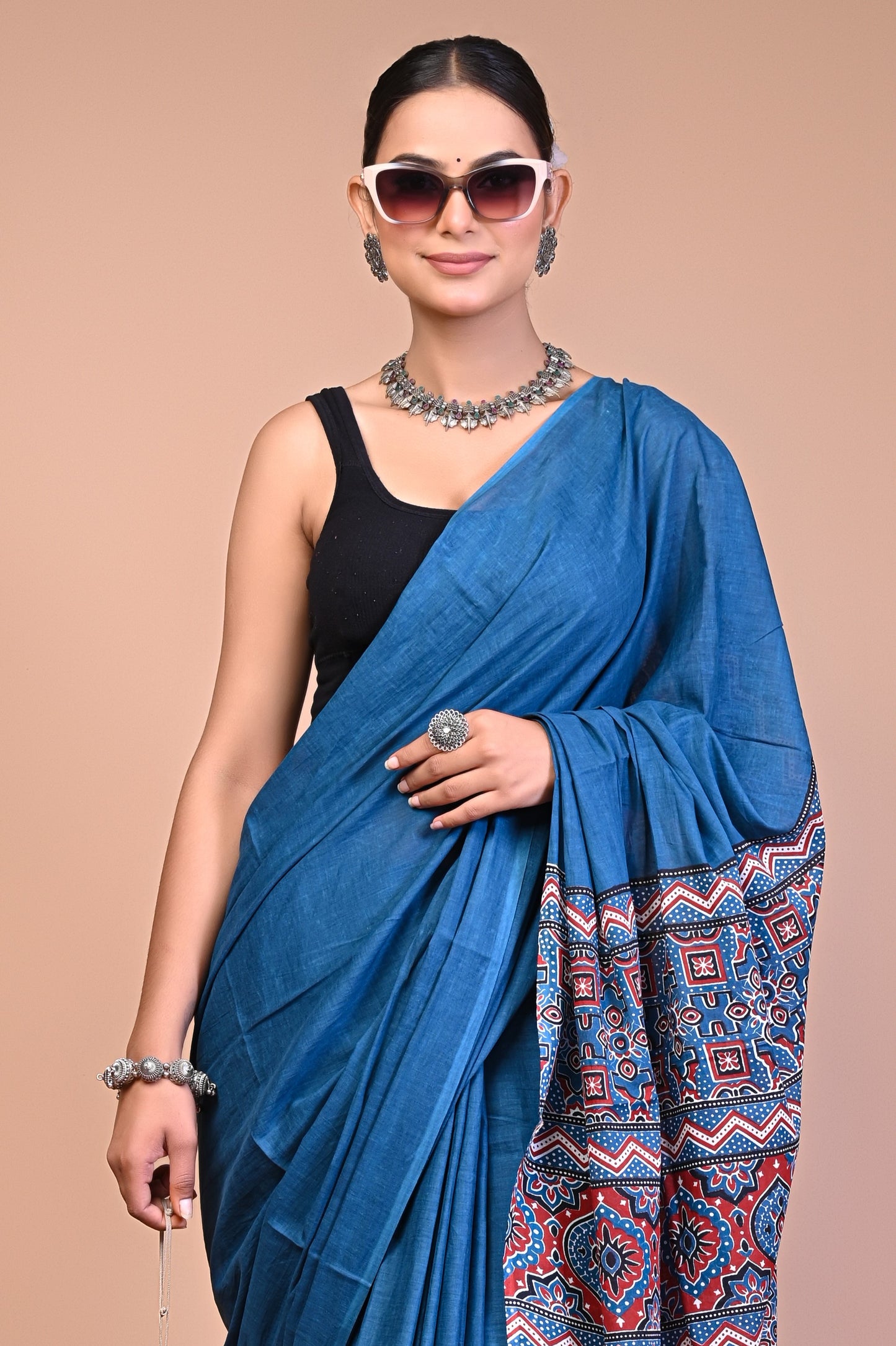 Elegant Blue Ajrakh Print Cotton Mul Saree worn by a model, showcasing intricate patterns and timeless style.