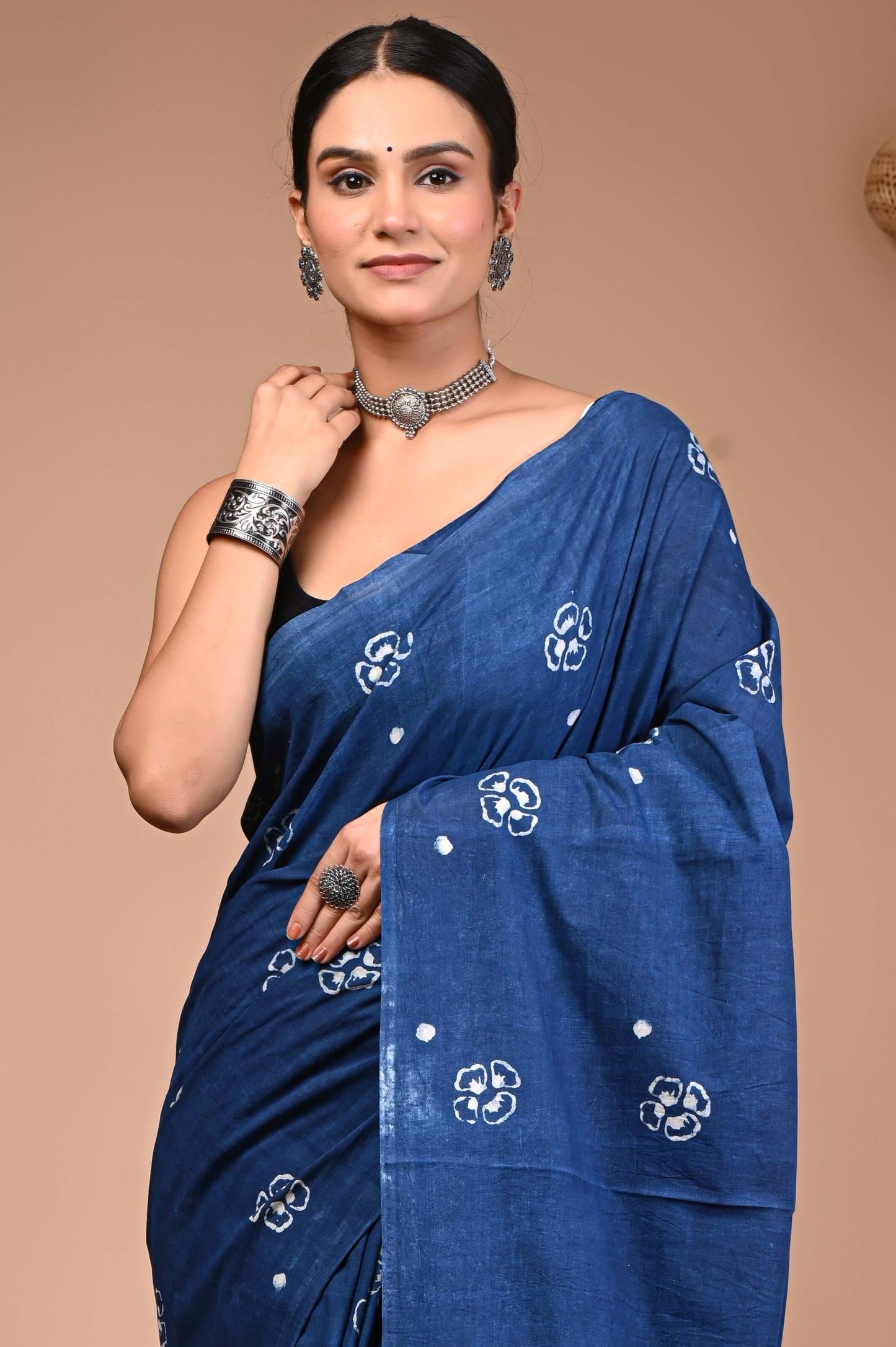 Model showcasing Indigo Hand Block Printed Cotton Saree with floral motifs and traditional jewelry.